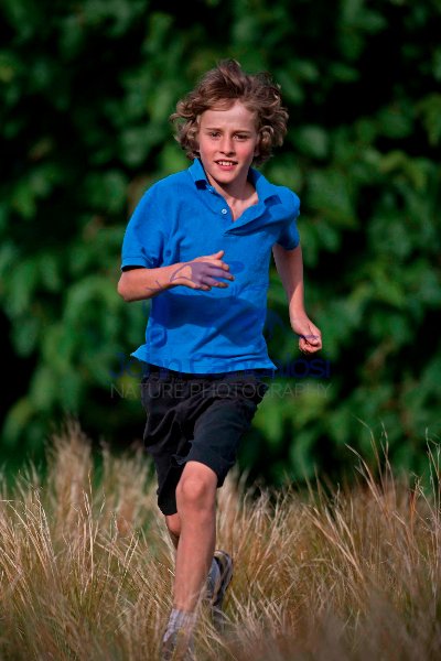 Boy Running in Field -  England - UK